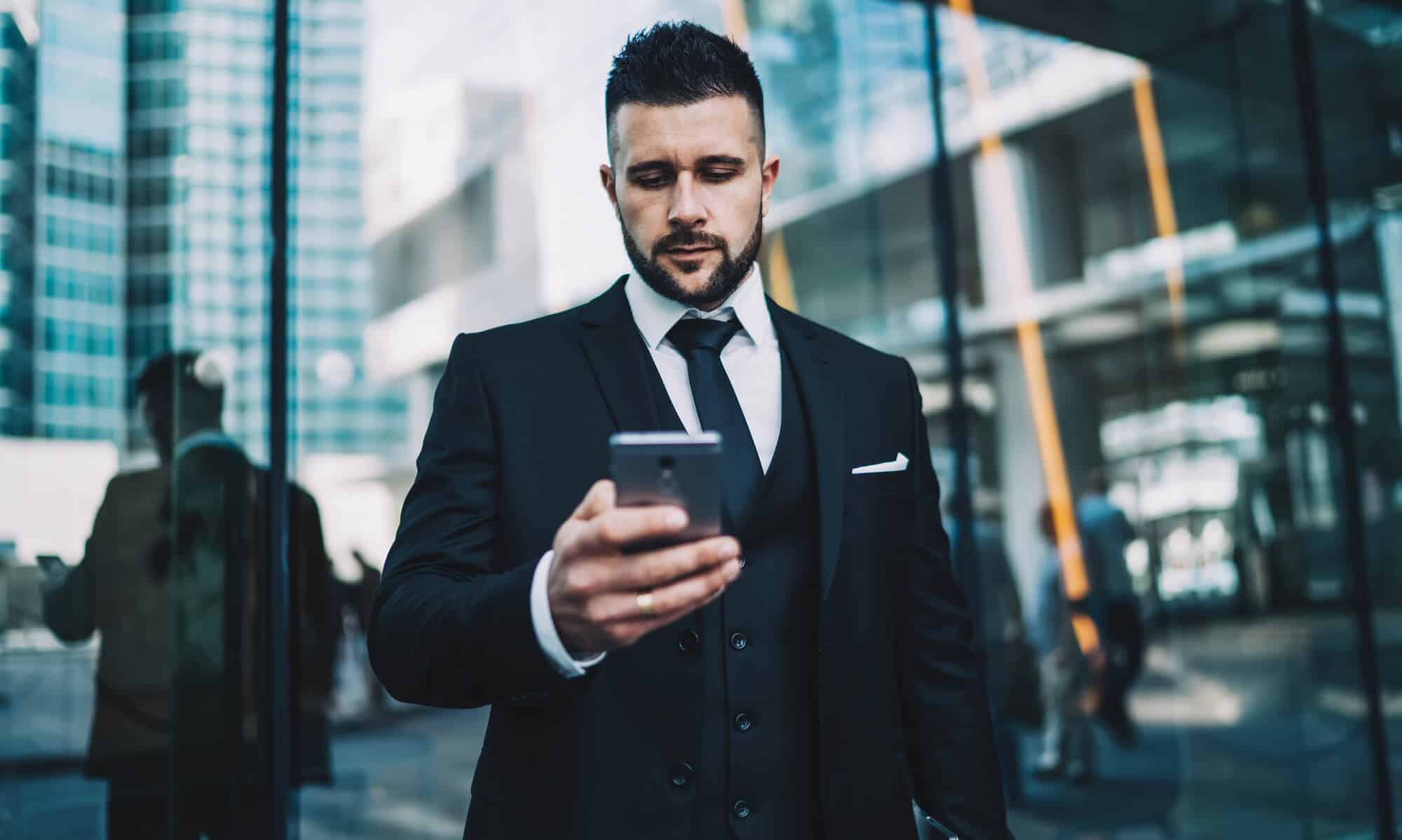 a lawyer texting an expert in Law Firm Marketing